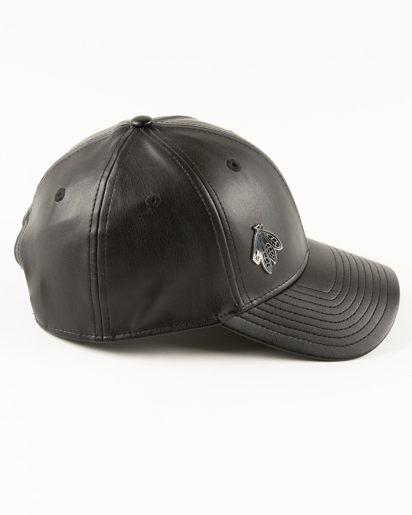 black leather New Era cap with Chicago Blackhawks four feathers logo in silver pin on front - right side lay flat
