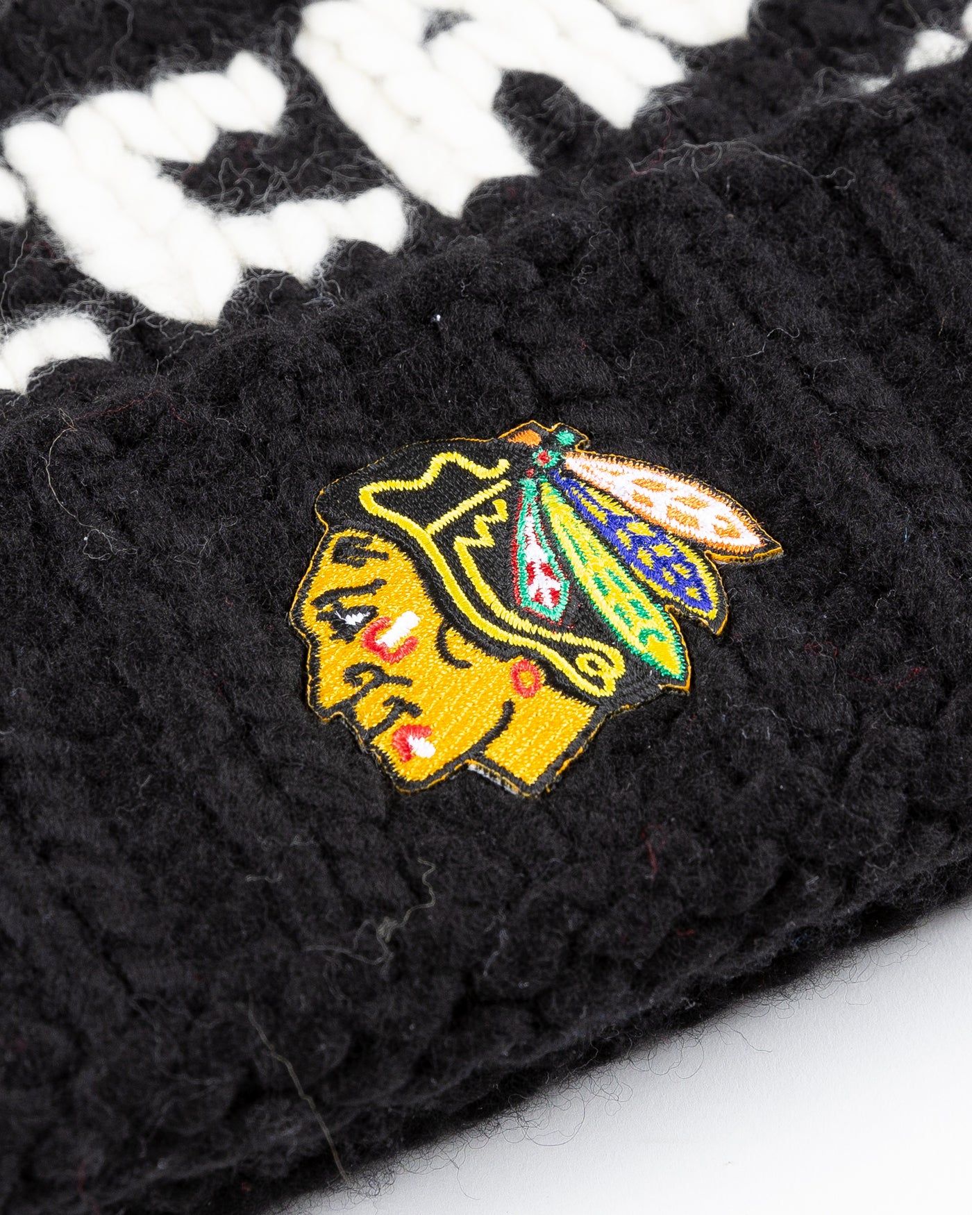 black Chicago Blackhawks beanie with detachable tan pom - detail logo lay flat