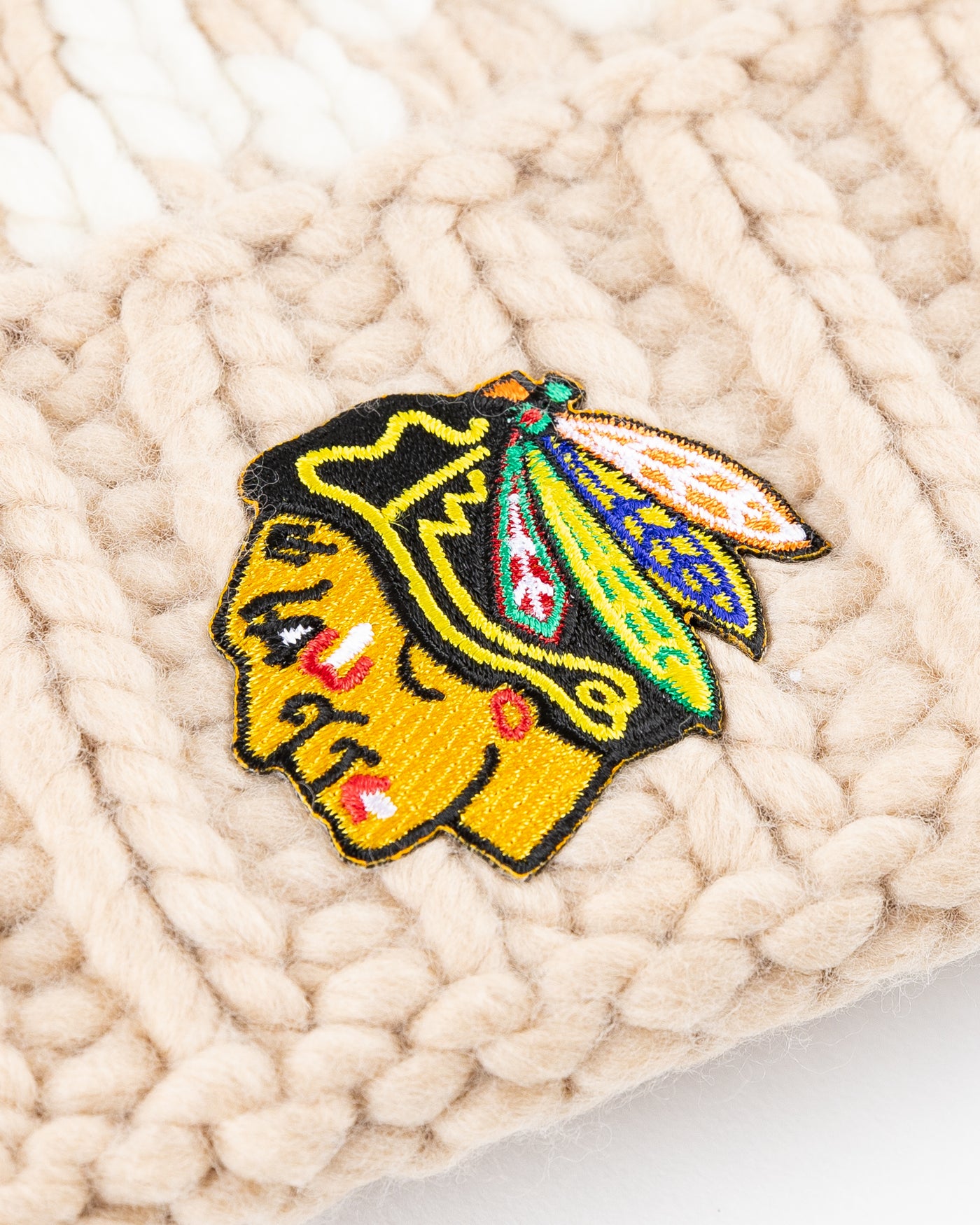 camel Chicago Blackhawks knit beanie with detachable tan pom - detail lay flat