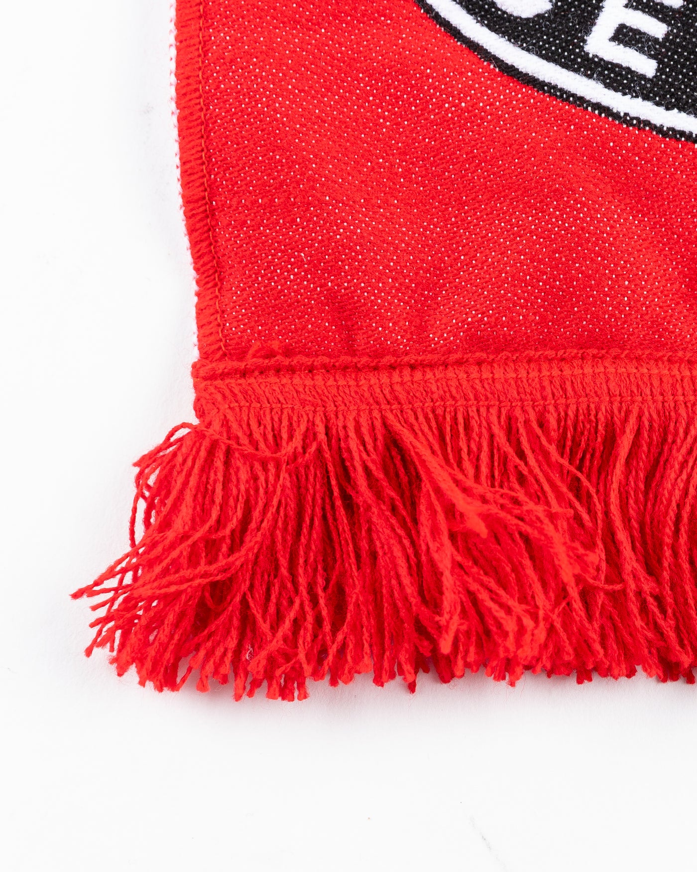 red Rockford IceHogs scarf with wordmark, logo and secondary Chicago Blackhawks logo - detail fringe lay flat