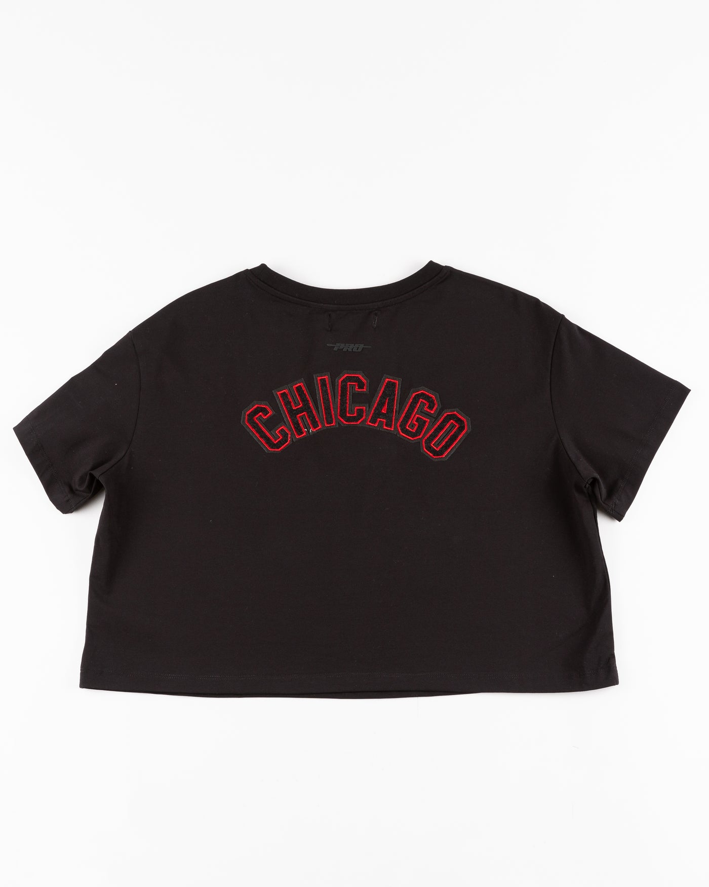 black cropped tee with embroidered Chicago Blackhawks patches on chest, shoulder and back - back lay flat