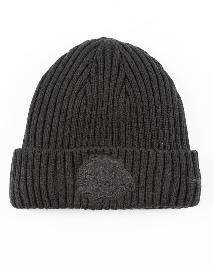 black Pro Standard knit beanie with tonal embroidered Chicago Blackhawks primary logo on front and embroidered tonal wordmark on back - front lay flat