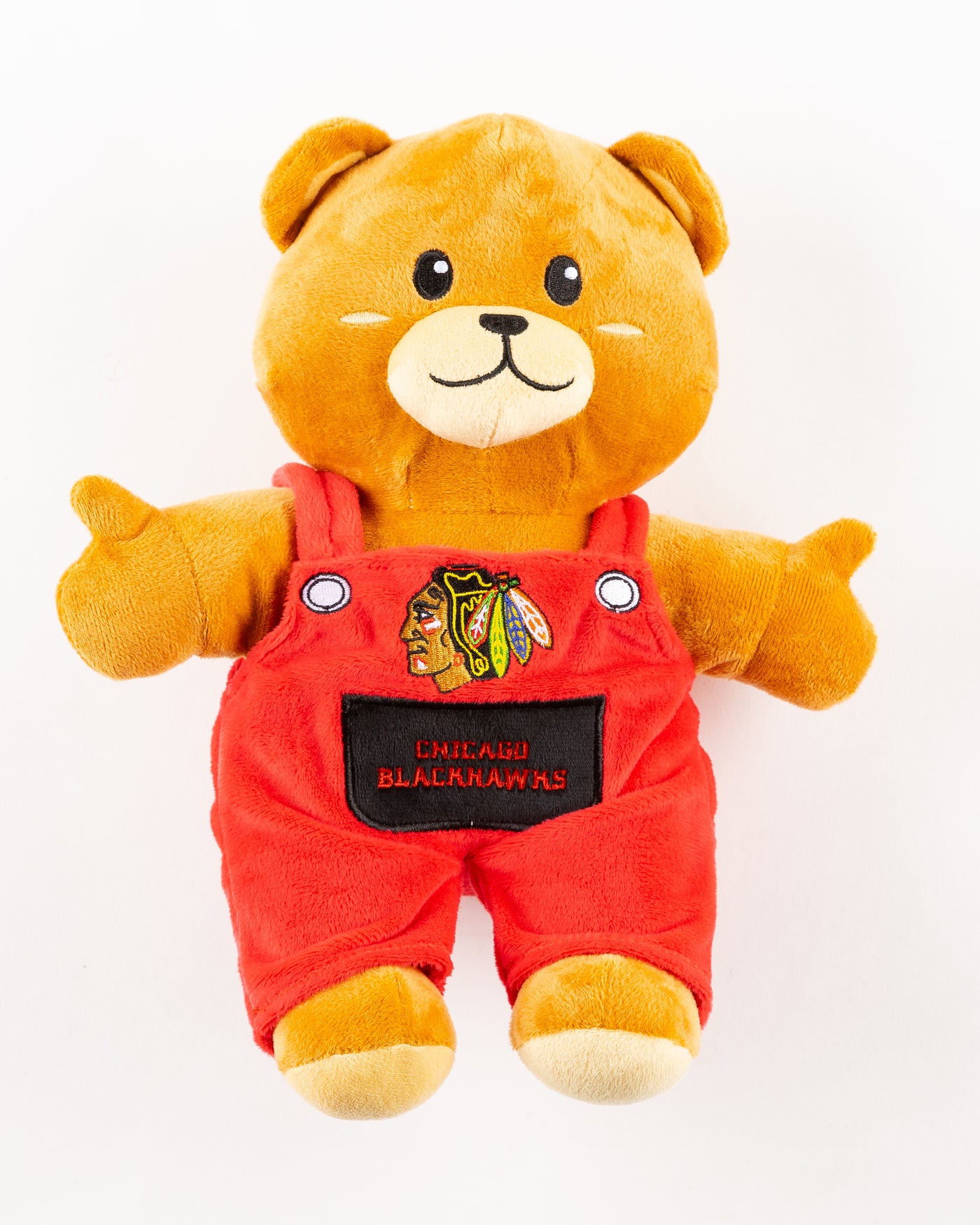 plush bear with red overalls with Chicago Blackhawks primary logo and wordmark embroidered on front - front lay flat