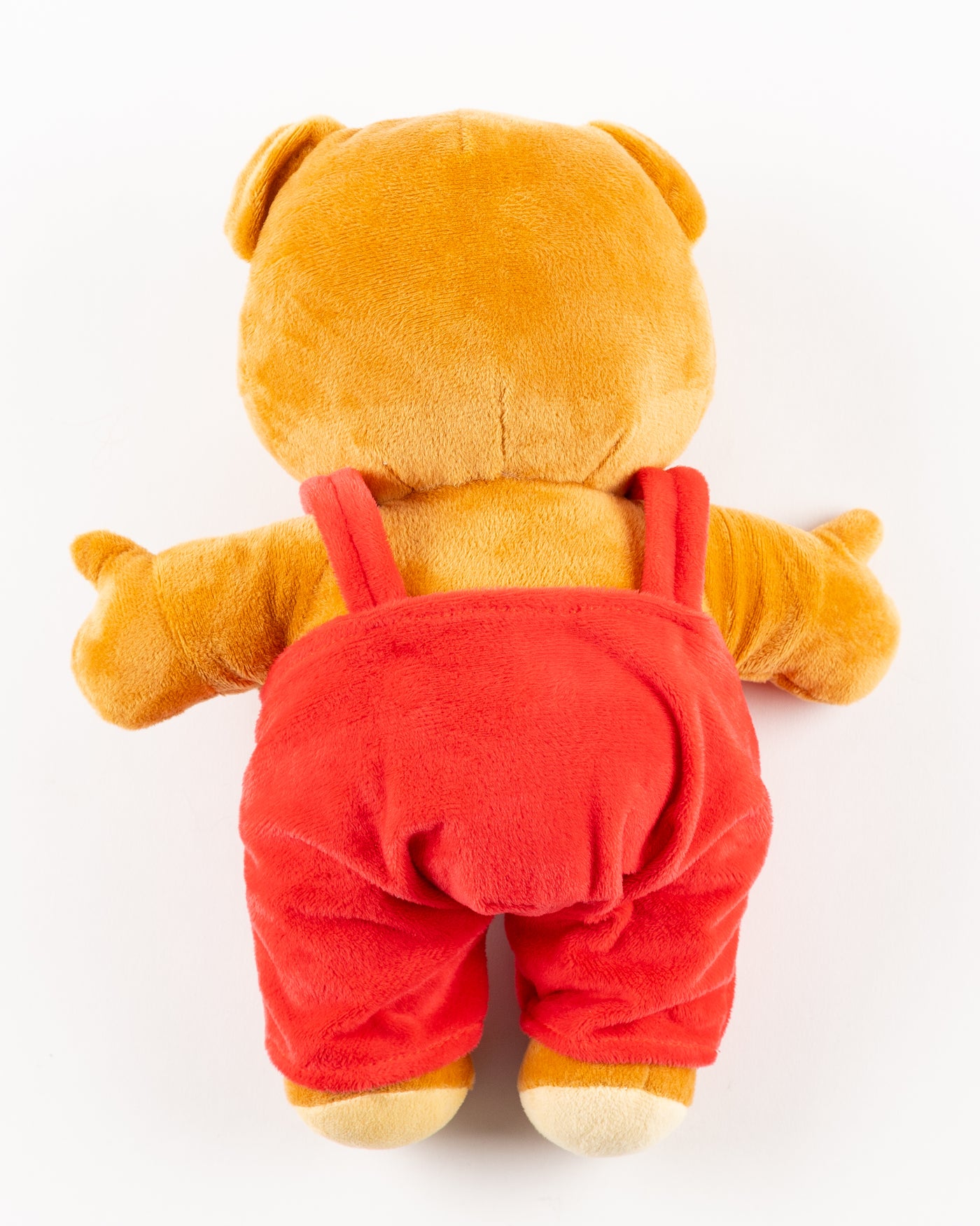 plush bear with red overalls with Chicago Blackhawks primary logo and wordmark embroidered on front - back lay flat