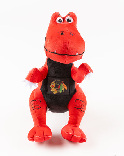 red dinosaur plush with Chicago Blackhawks primary logo on front - front lay flat