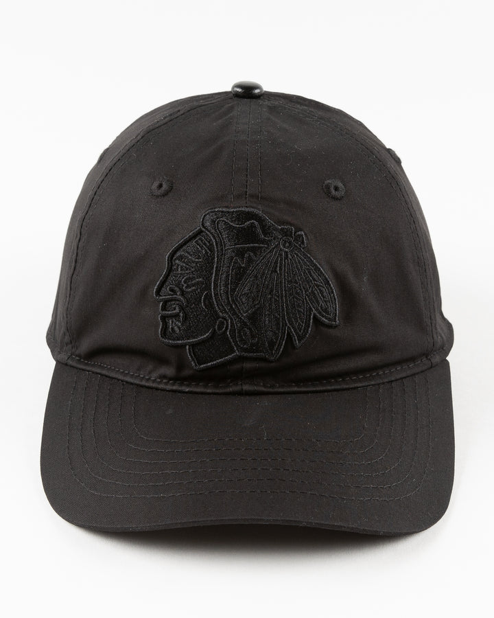 all black adjustable cap with tonal Chicago Blackhawks primary logo embroidered on front - front lay flat 