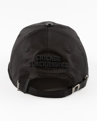 all black adjustable cap with tonal Chicago Blackhawks primary logo embroidered on front - back lay flat 