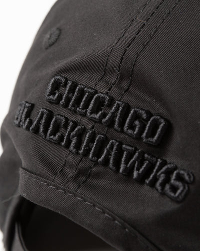 all black adjustable cap with tonal Chicago Blackhawks primary logo embroidered on front - detail back lay flat 