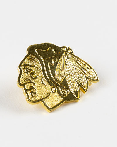 gold Chicago Blackhawks primary logo pin - angled lay flat