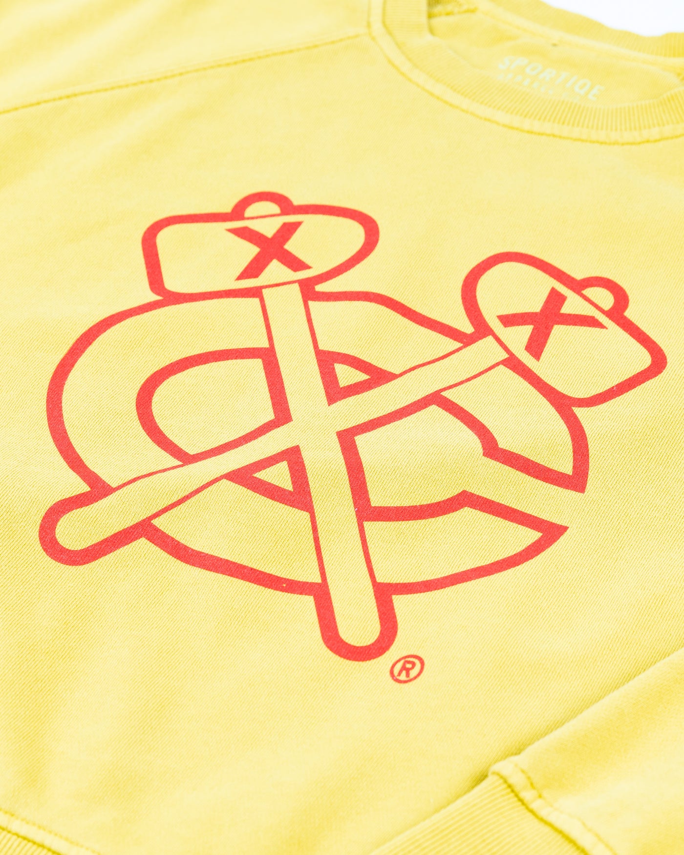 yellow Sportiqe ladies crewneck with Chicago Blackhawks secondary logo on front - detail lay flat