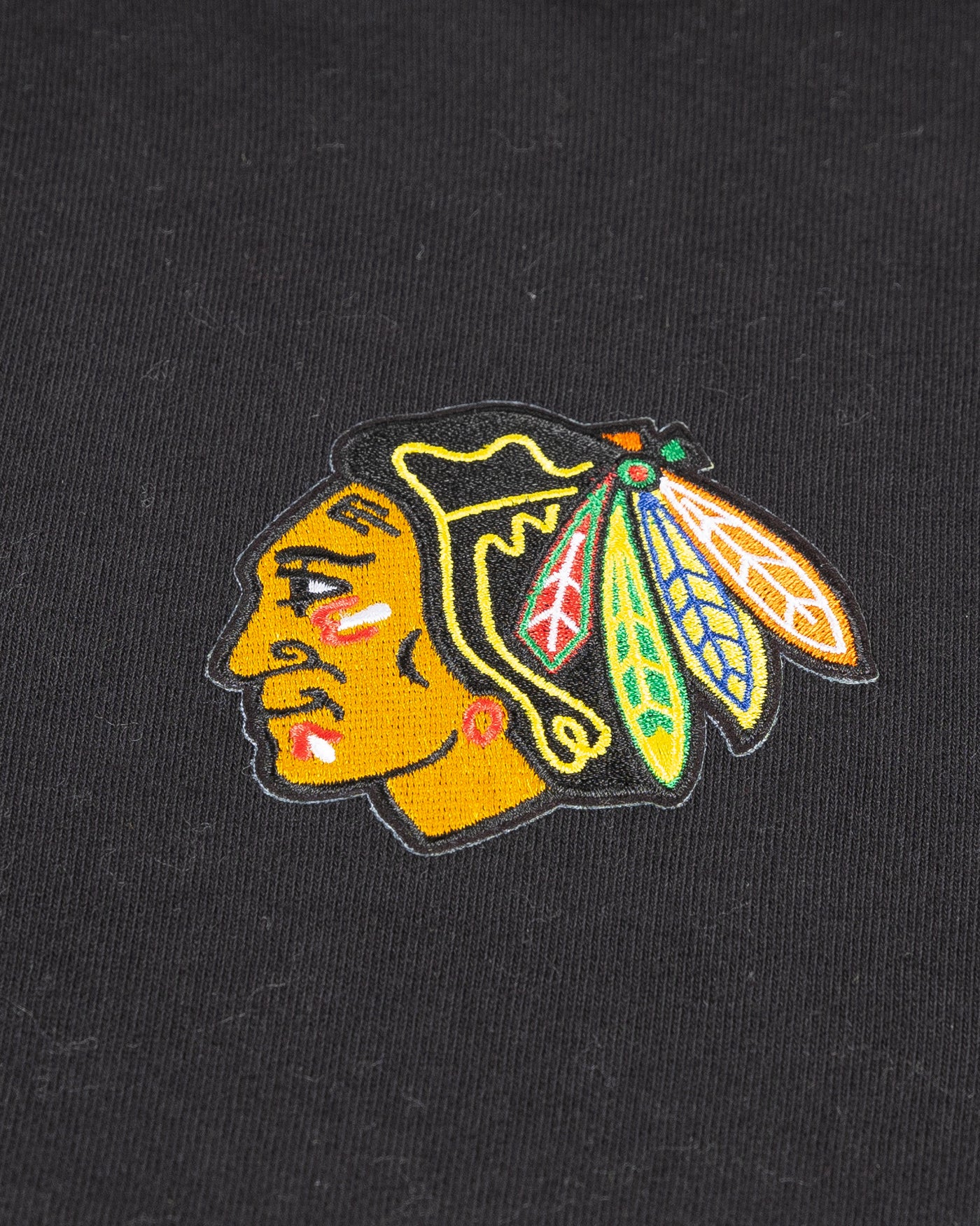 black Sportiqe quarter zip with Chicago Blackhawks primary logo embroidered on left chest - detail lay flat