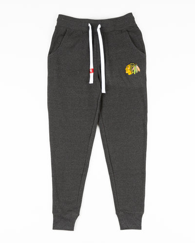black Sportiqe sweatpants with Chicago Blackhawks primary logo embroidered on left hip - front lay flat