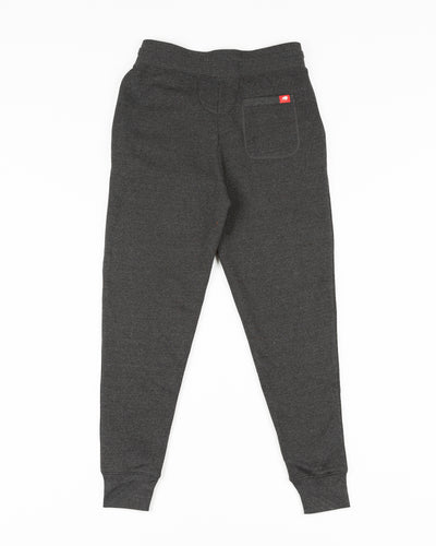 black Sportiqe sweatpants with Chicago Blackhawks primary logo embroidered on left hip - back lay flat