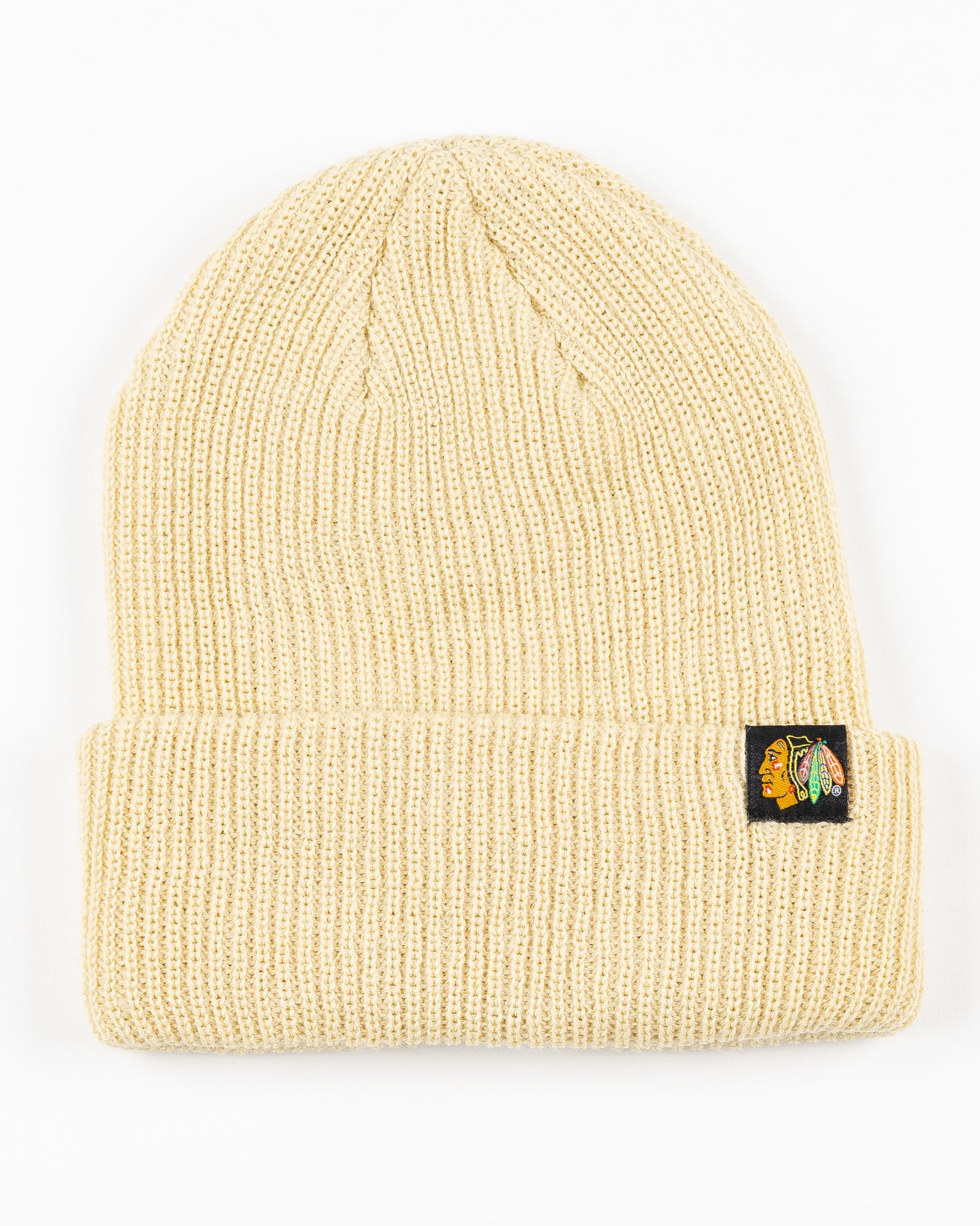 cream colored Sportiqe knit beanie with Chicago Blackhawks primary logo patch stitched on front cuff - front lay flat