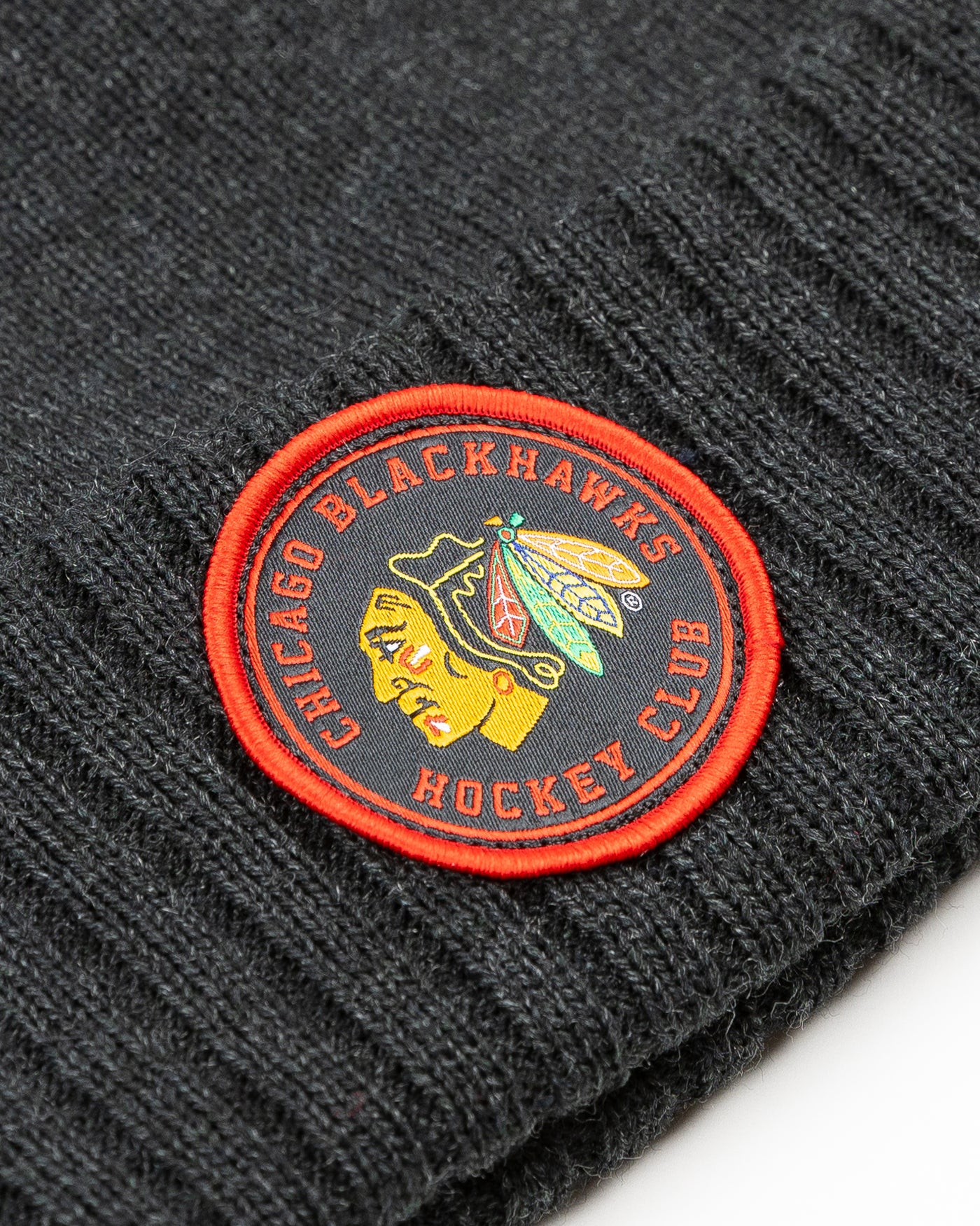 black Sportiqe knit beanie with Chicago Blackhawks embroidered patch on front cuff - detail lay flat