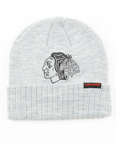 grey cuffed Sportiqe beanie with Chicago Blackhawks tonal primary logo on nfront and mini Chicago patch on cuff - front lay flat