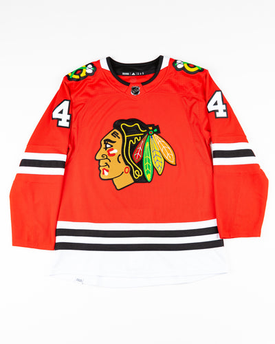 red adidas Chicago Blackhawks jersey with Seth Jones name and number - front lay flat