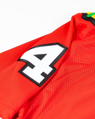 red adidas Chicago Blackhawks jersey with Seth Jones name and number - detail shoulder lay flat