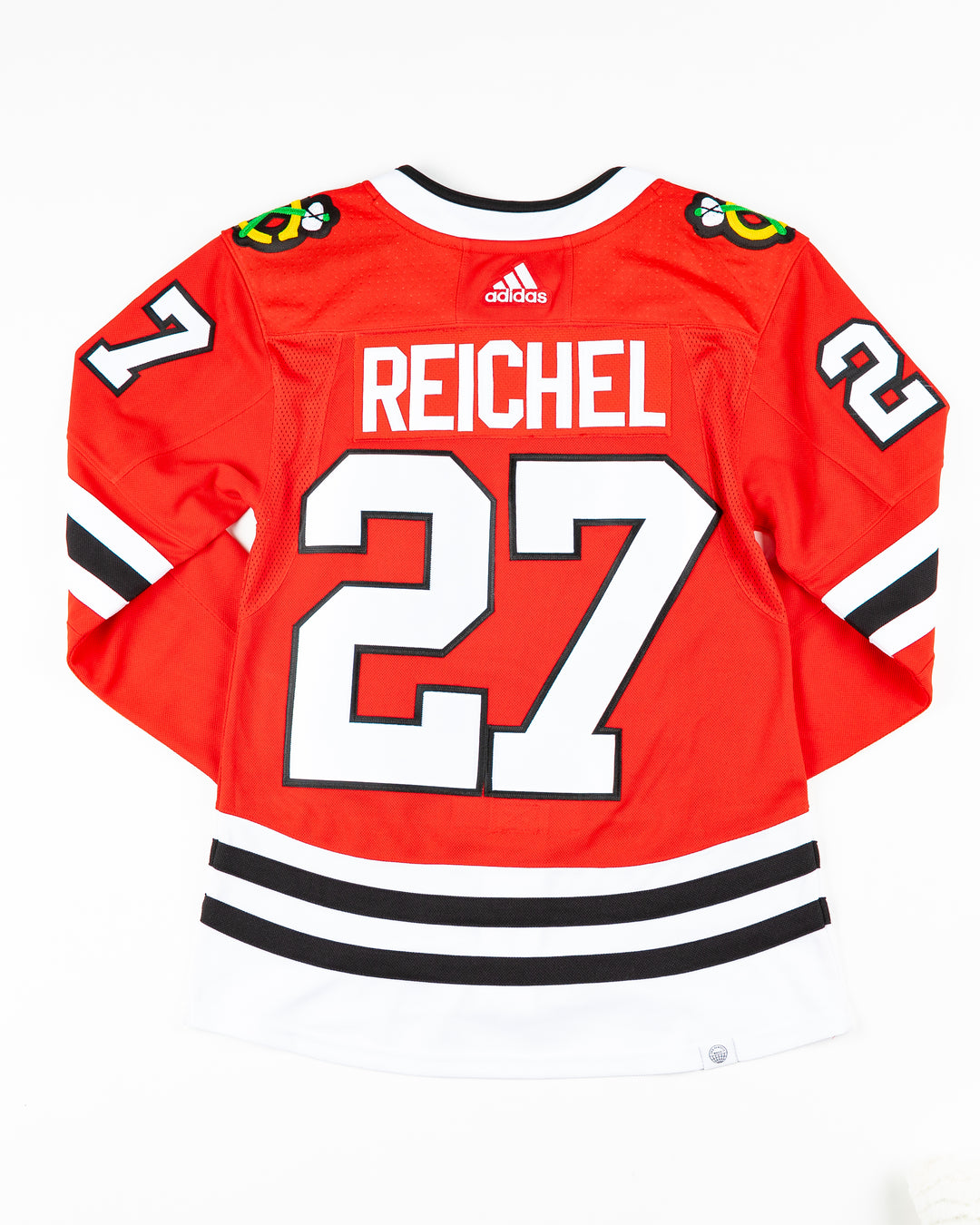 red adidas Chicago Blackhawks jersey with Lukas Reichel name and number stitched - back lay flat