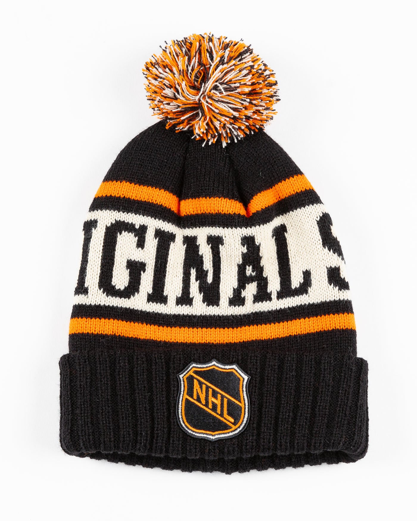 black, beige and orange knit beanie with pom with NHL patch stitched on front cuff - front lay flat