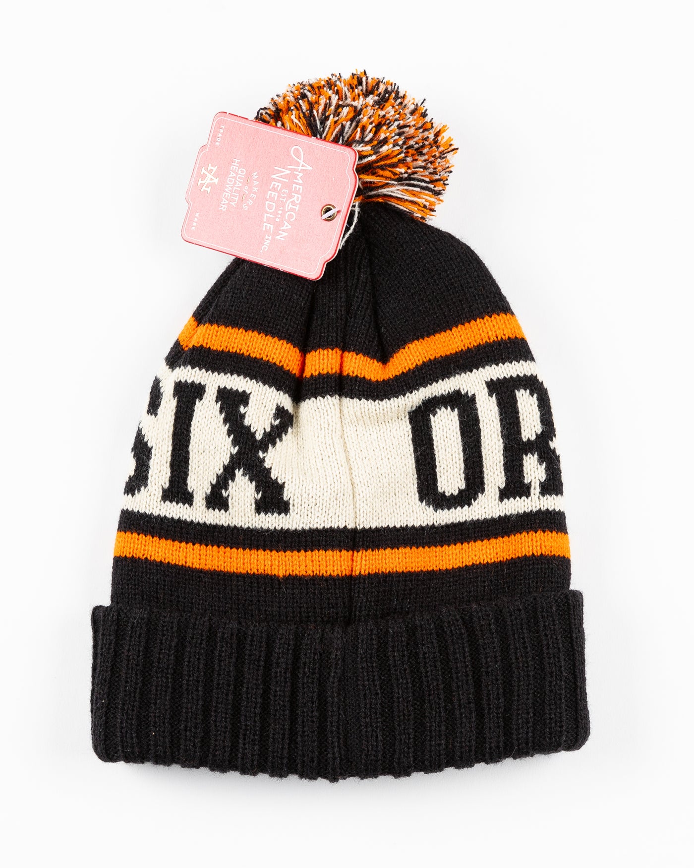 black, beige and orange knit beanie with pom with NHL patch stitched on front cuff - back lay flat