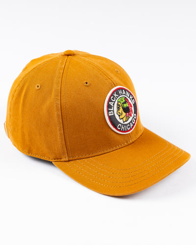 brown American Needle snapback cap with vintage Chicago Blackhawks logo embroidered on front - right angle lay flat