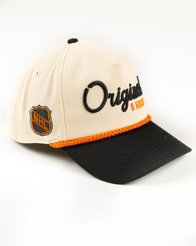 beige, black and orange snapback rope hat with Original Six hockey word graphic across front and vintage Chicago Blackhawks logo embroidered on left side - right angle lay flat
