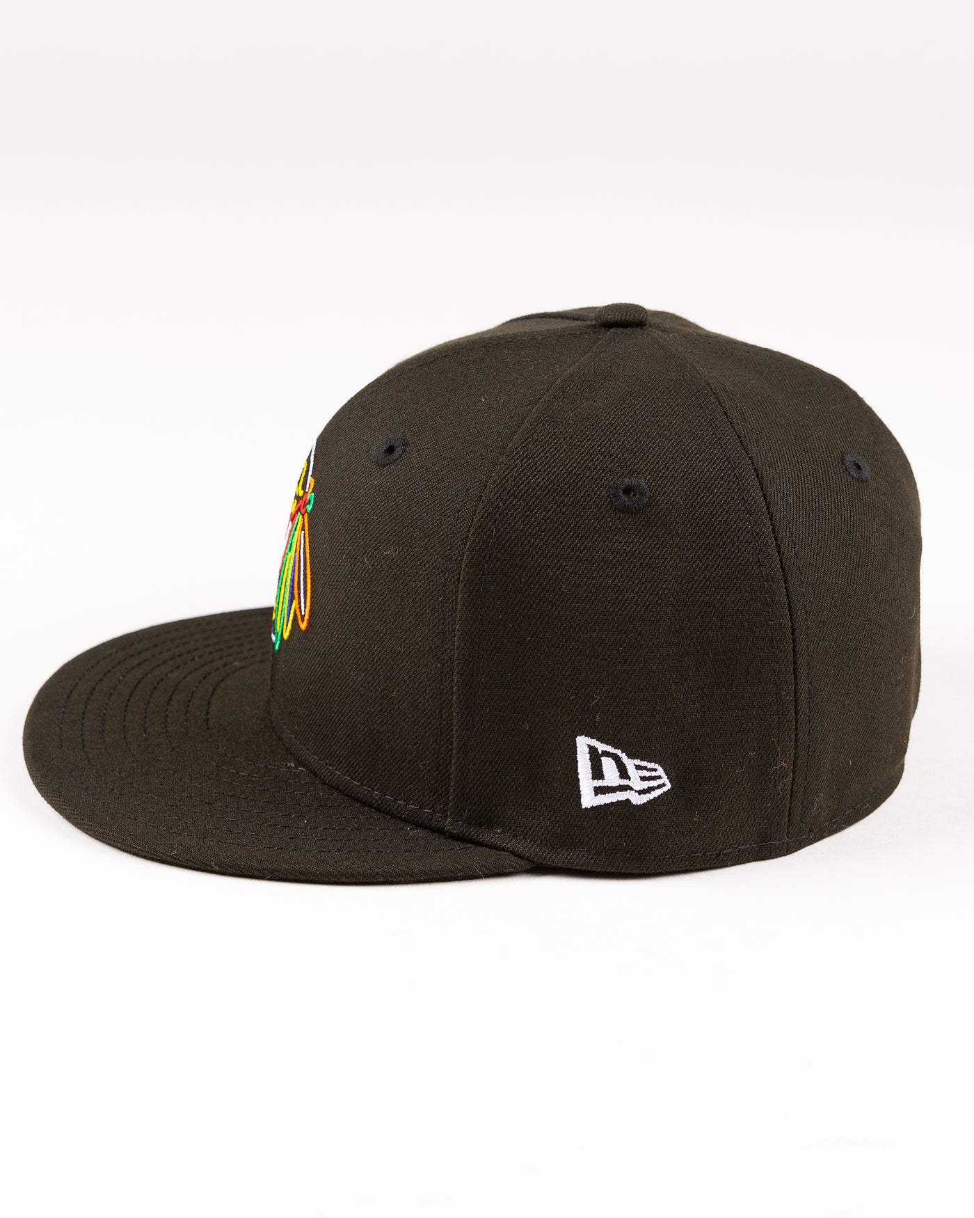 black New Era fitted cap with Chicago Blackhaks primary logo embroidered in front and secondary logo embroidered on back in neon lights colorway - left side lay flat