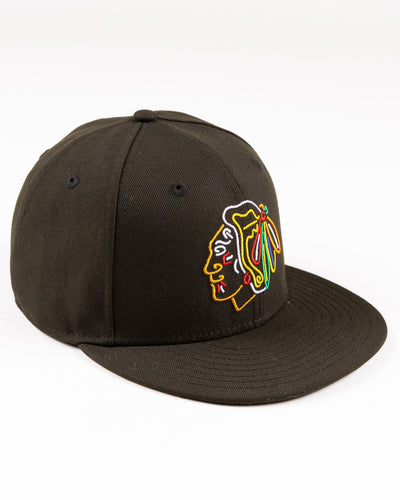 black New Era fitted cap with Chicago Blackhaks primary logo embroidered in front and secondary logo embroidered on back in neon lights colorway - right angle lay flat