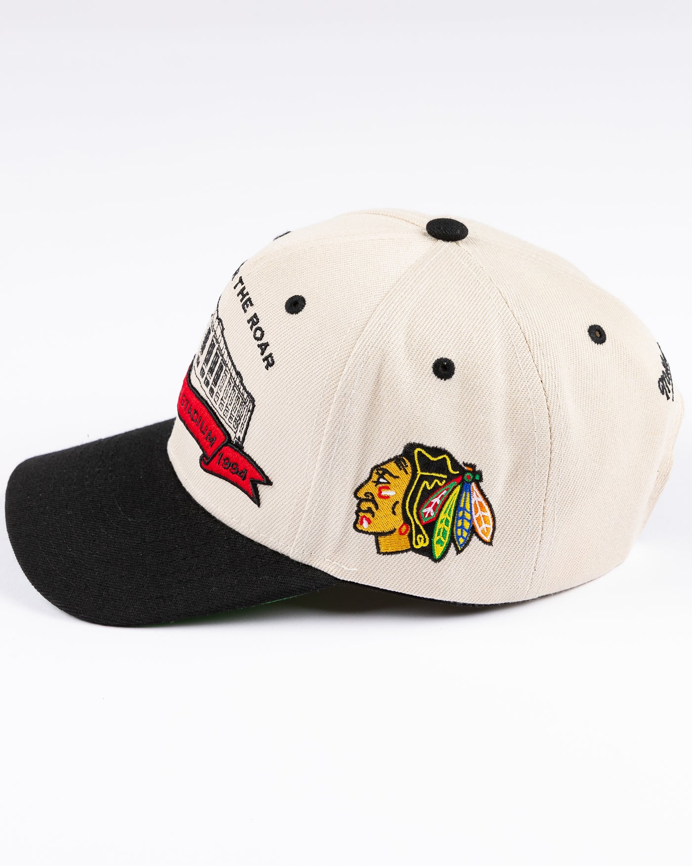 beige Mitchell & Ness snapback cap with Chicago Stadium embroidered design and Chicago Blackhawks primary logo on left side - left side lay flat