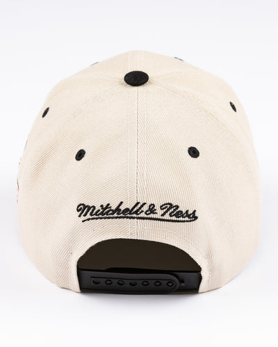 beige Mitchell & Ness snapback cap with Chicago Stadium embroidered design and Chicago Blackhawks primary logo on left side - back lay flat