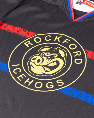 CCM black Autism Awareness jersey for the Rockford IceHogs - detail lay flat