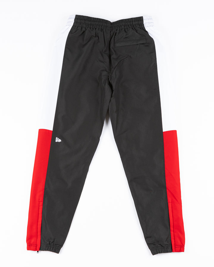 black red and white color blocked track pants with Chicago Blackhawks primary logo and wordmark on left leg - back lay flat