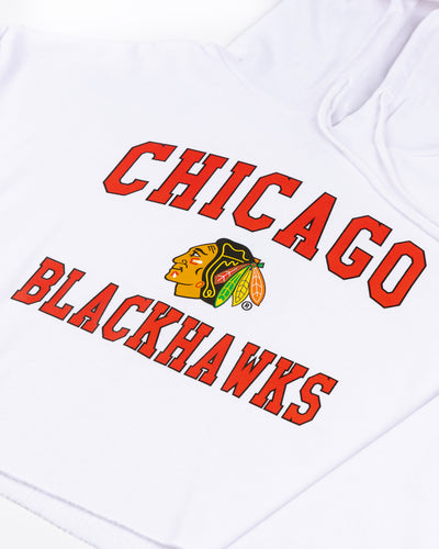 cropped white chicka-d ladies hoodie with Chicago Blackhawks wordmark and primary logo graphic across chest - detail lay flat