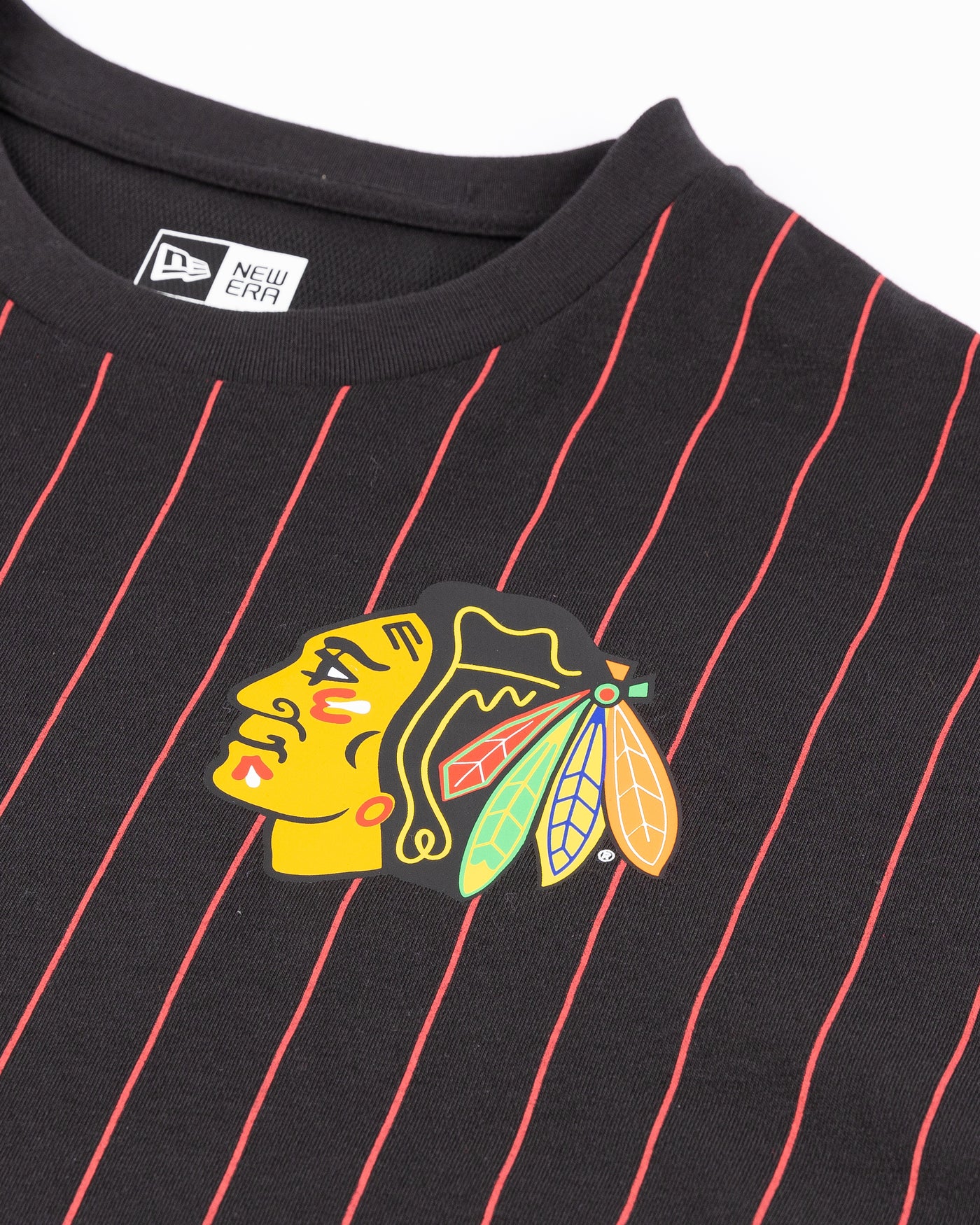 black with red pinstripes New Era cropped ladies tee with Chicago Blackhawks primary logo printed on left chest - detail lay flat