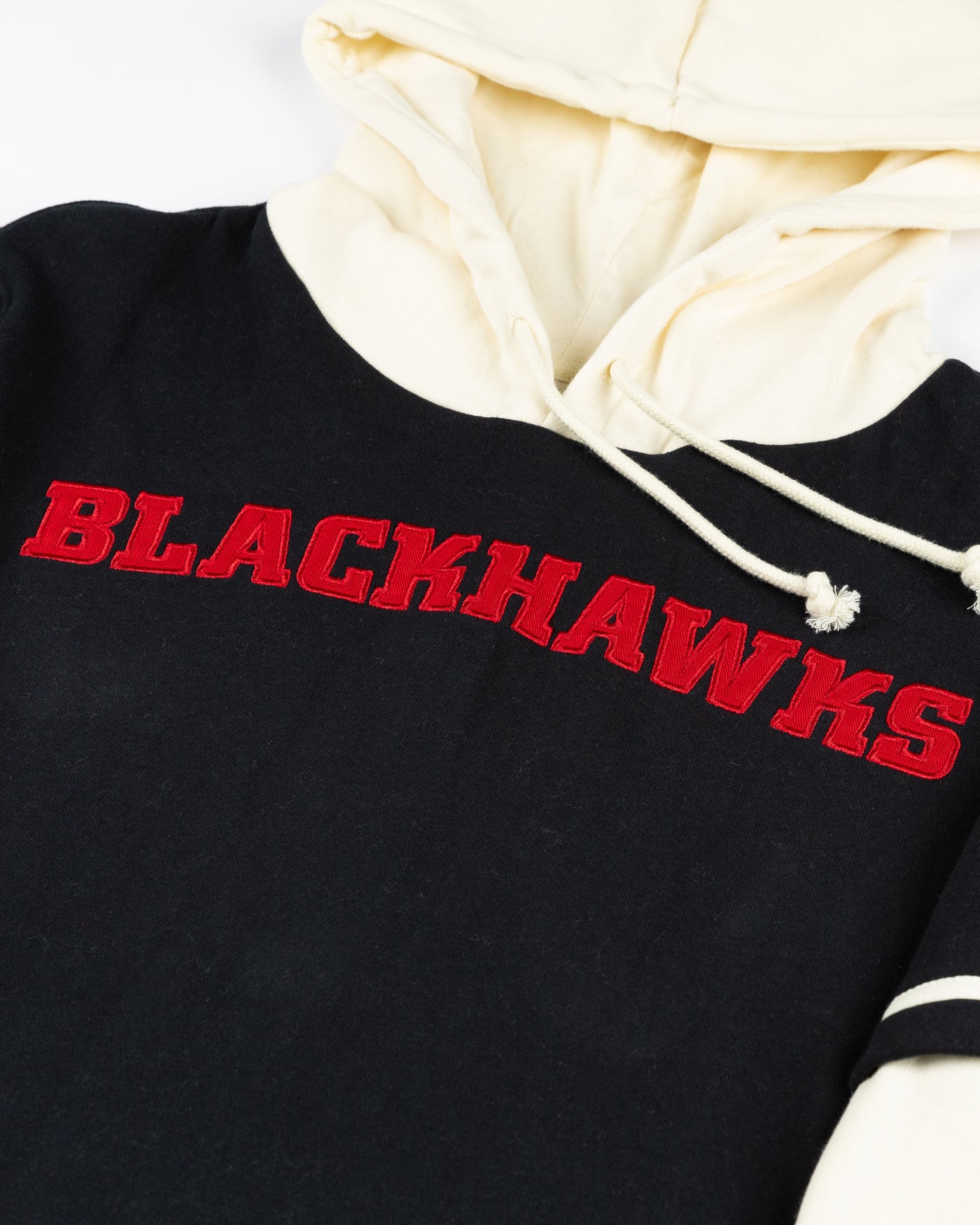 '47 brand layered hoodie with Chicago Blackhawks wordmark on front and primary and secondary logos on shoulders - detail lay flat