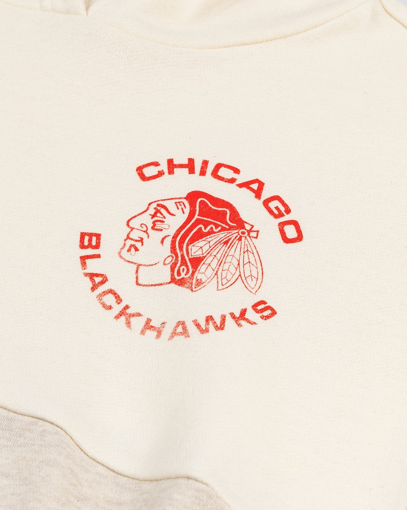 two tone oatmeal cropped ladies hoodie from '47 brand with Chicago Blackhawks logo on left chest - detail lay flat