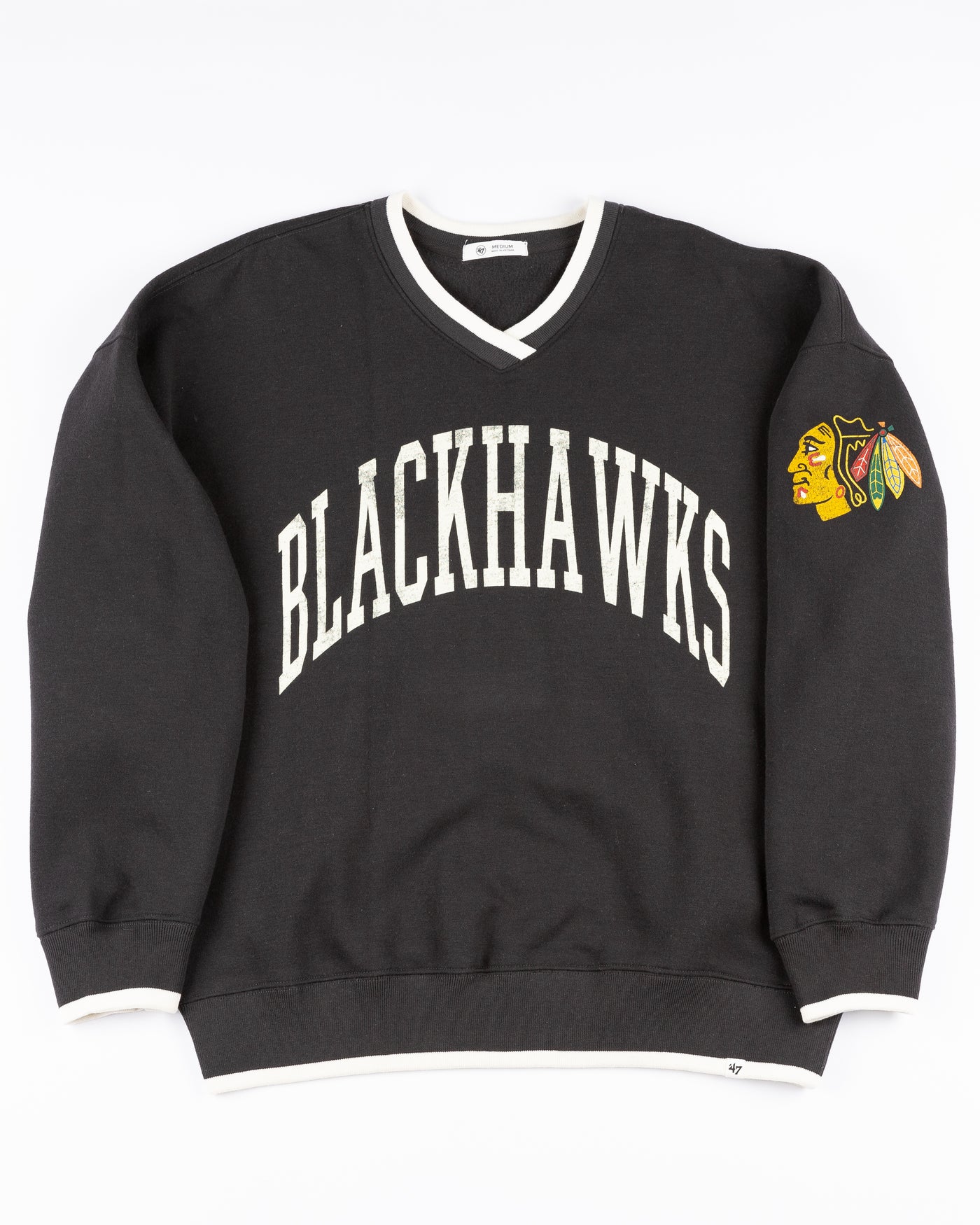 black '47 brand ladies v neck sweater with Chicago Blackhawks wordmark on front and primary logo on left shoulder - front lay flat