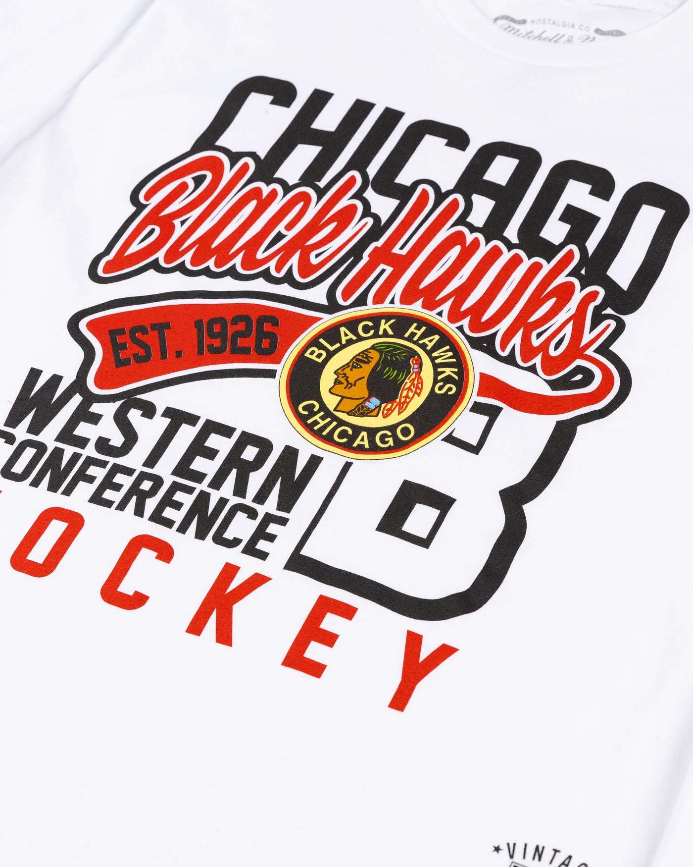 white Mitchell & Ness youth long sleeve tee with word graphic across front and vintage Chicago Blackhawks logo - front detail lay flat