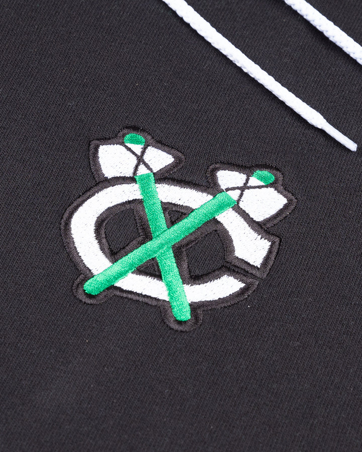 black Saint Patrick's day hoodie with Chicago Blackhawks secondary logo embroidered on left chest - detail lay flat