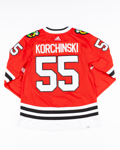 red adidas Chicago Blackhawks jersey with Kevin Korchinski name and number stitched - back lay flat