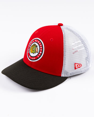 New Era 9FIFTY trucker snapback cap with Chicago Blackhawks throwback logo embroidered on front - left angle lay flat