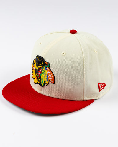 cream and red two tone fitted New Era 59FIFTY cap with embroidered Chicago Blackhawks primary logo on front - left angle lay flat