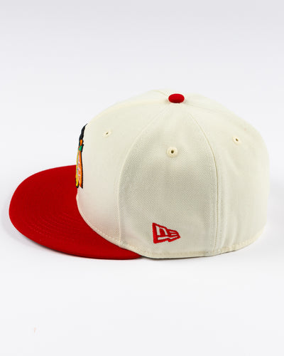 cream and red two tone fitted New Era 59FIFTY cap with embroidered Chicago Blackhawks primary logo on front - left side lay flat