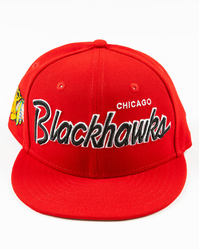 red youth New Era snapback cap with Chicago Blackhawks embroidered wordmark and primary logo on right side - front lay flat