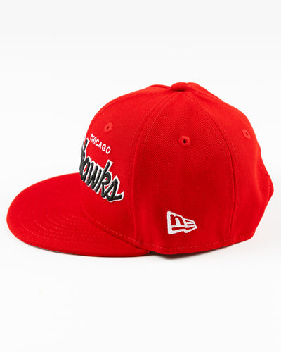 red youth New Era snapback cap with Chicago Blackhawks embroidered wordmark and primary logo on right side - left side lay flat