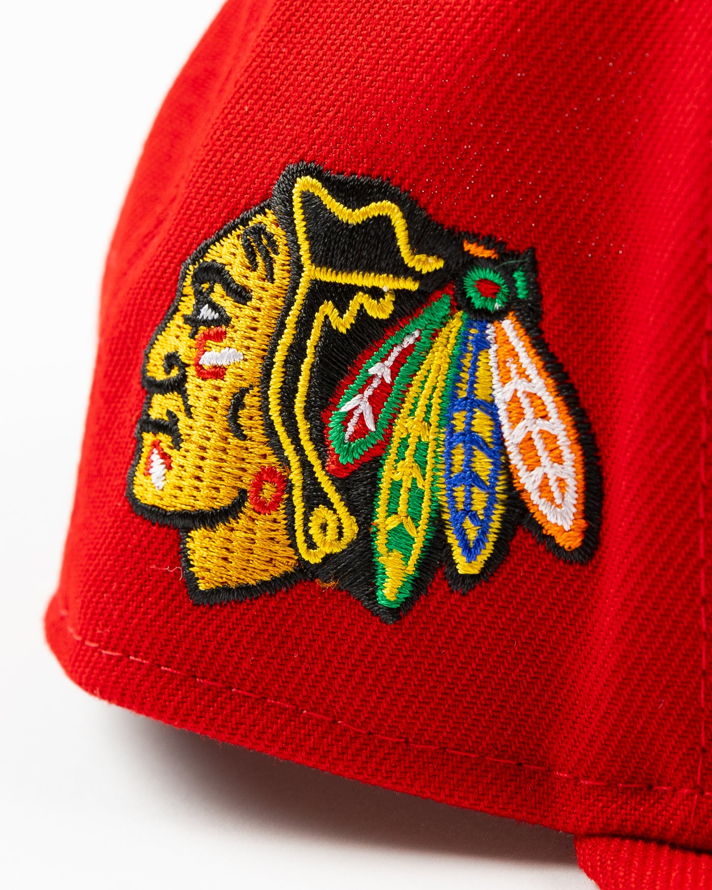 red youth New Era snapback cap with Chicago Blackhawks embroidered wordmark and primary logo on right side - alt detail lay flat