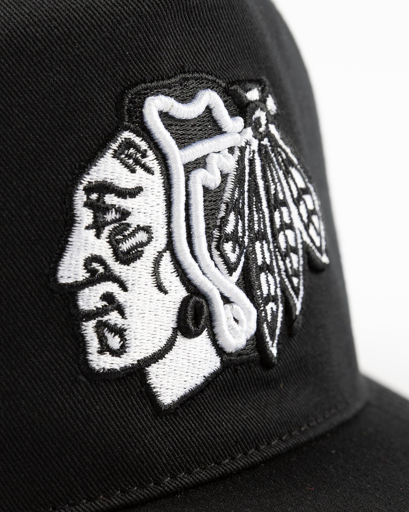 '47 black adjustable snapback cap with tonal Chicago Blackhawks primary logo embroidered on front and secondary logo embroidered on right side - detail lay flat