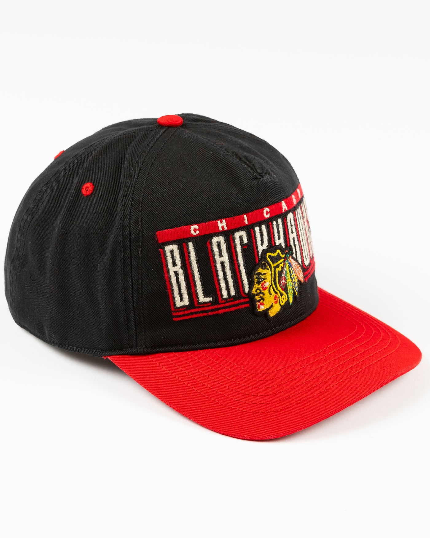 black and red '47 brand snapback hat with Chicago Blackhawks wordmark and primary logo embroidered on the front - right angle lay flat