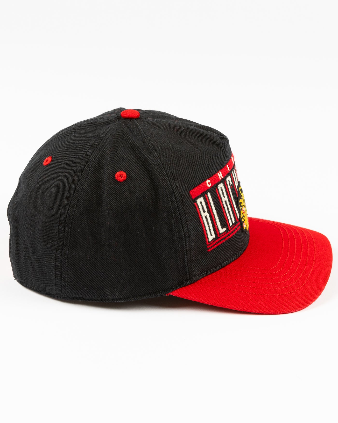 black and red '47 brand snapback hat with Chicago Blackhawks wordmark and primary logo embroidered on the front - right side lay flat